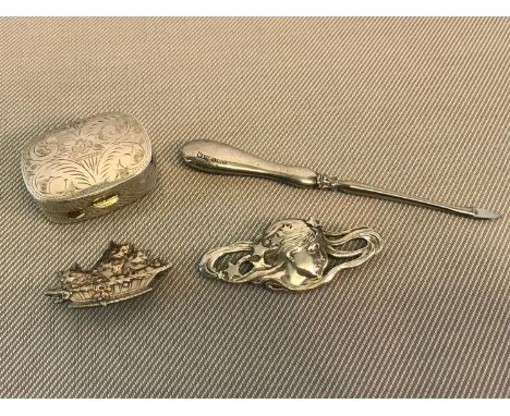 Silver pill box, Silver handled manicure item and 2 silver brooches 