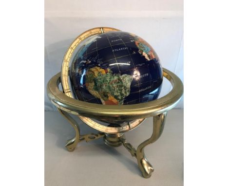 Medium sized semi precious stone globe fitted on a brass stand 