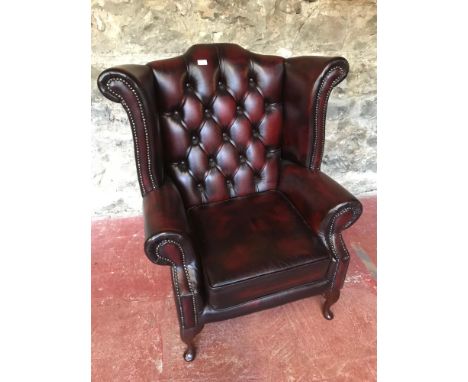 OX-Blood red button back, gull wing chesterfield chair. 