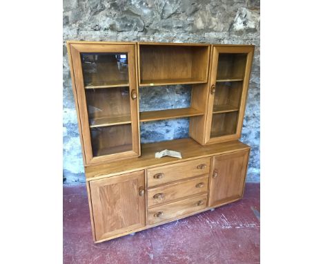 Ercol light oak Windsor display cabinet with bag of extra shelf pins. Measures 162x156x44cm 