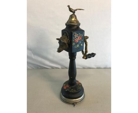Vintage wooden hand painted and white metal gilt pepper grinder. Fitted with a musical base wind up. Stands 27cm in height. 