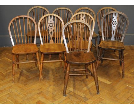 A composite set of nine ash and elm stick back and wheel back Windsor kitchen chairs