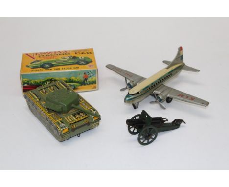 A circa 1950 selection of tin plate toys including Electric remote controlled Vanwall racing car, boxed, an artillery field g
