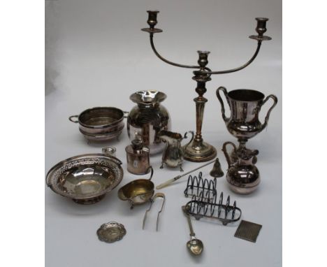 A mixed lot of 19th century and later silver plate, including a Harrow School racquets trophy cup, tea caddy, toast racks, co