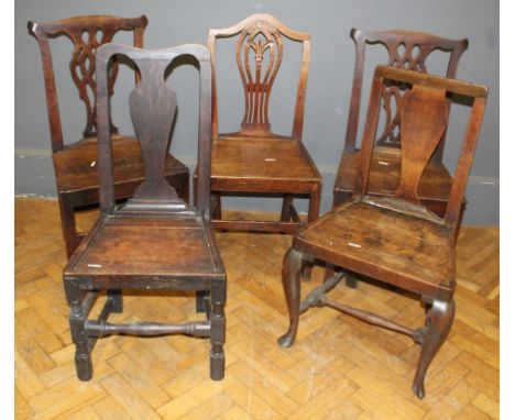 A pair of 18th century provincial oak dining chairs in the Chippendale style, another early 18th century oak dining chair and