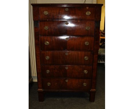 A late 19th century French mahogany chest of six drawers, with cast brass ring handles within floral capital stiles, on block