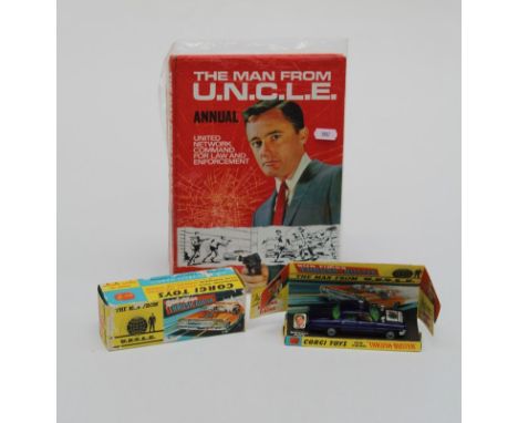 A boxed ' Man from Uncle' Corgi die cast car with the rare finger ring. All complete, box very good