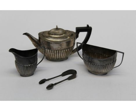 A three piece Victorian silver bachelors teaset comprising a teapot, sugar basin, milk jug , Sheffield 1889, Goldsmith and Si