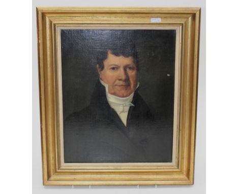 Early 19th century French School A half length portrait of a gentleman in a dark coat wearing an ivory stock. Oil on relined 