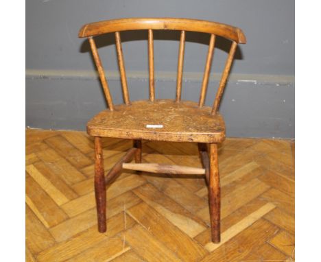 A provincial miniature ash and beech stick back elbow chair with yoke shaped toprail