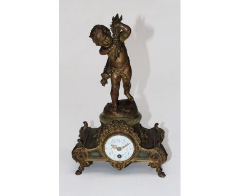 A 19th century French gilded spelter mantle clock, the cupid surmount after Moreau on a downswept rectangular base enclosing 