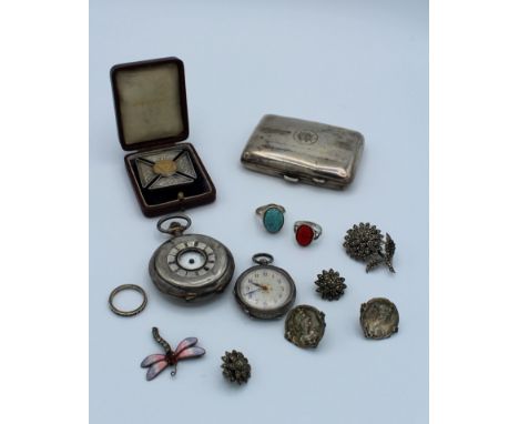 A collection of silver watches and jewellery comprising three rings, two pairs of clip earrings, an as found enamel dragon fl