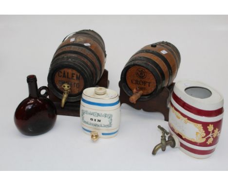 Two coopered counter top part barrels, Calem and Croft, largest 31cm, two Wade ceramic spirit flasks and a brown glass onion 