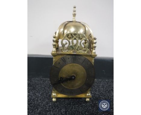 A brass Smiths lantern clock