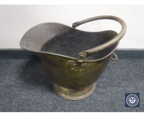 A 19th century brass coal helmet