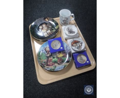 A tray of five Hummel collector's plates, Hummel mug and four boxed shallow dishes 