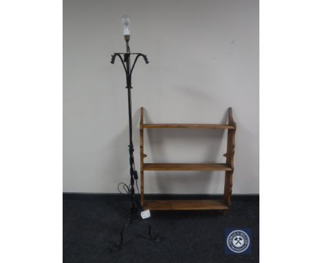A pine plate rack together with a wrought iron standard lamp