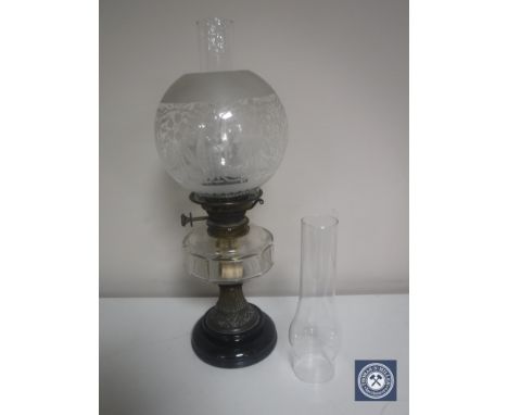 A Victorian Messenger's No. 1 oil lamp with glass reservoir, chimney and shade and a spare chimney 