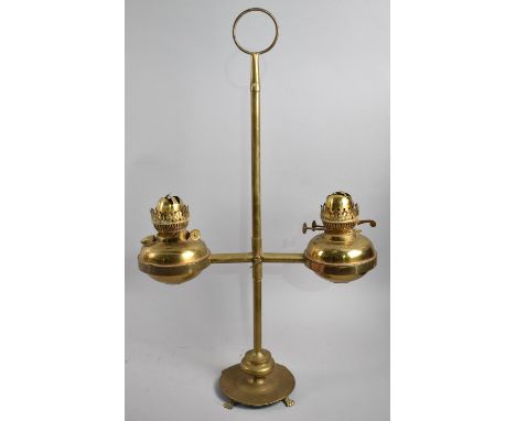 A Late Victorian/Edwardian Brass Rise and Fall Two Branch Oil Lamp with Ring Carrying Handle, 70cm high 