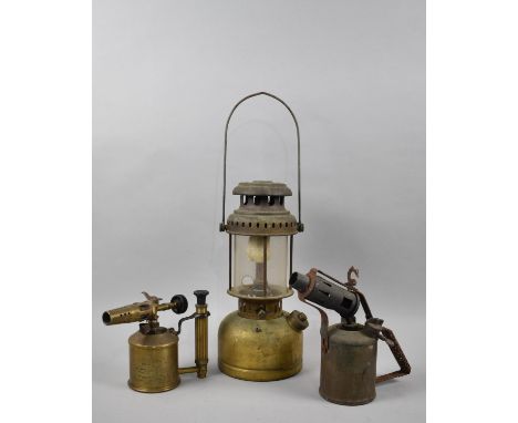 A Vintage Brass Hurricane Lamp and Two Vintage Blow Torches 
