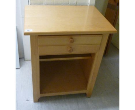 A modern Stanley light coloured beech finished bedside cabinet, the two short drawers over an open compartment  25''h  21''w 