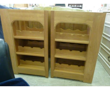 A pair of Mark Wilkinson 'under cabinet'  wine racks, each having three shelves and provision for nine bottles, on a plinth  