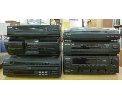 An Aiwa six piece stereo stacking system  comprising a record deck, a CD player, an amp, a tuner and a cassette deck       F