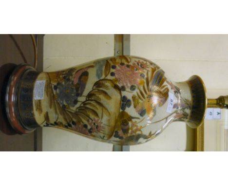 A modern ceramic vase of tapered, baluster form, decorated with peacocks in a landscape, later converted to a lamp, on a circ