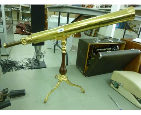 A modern lacquered brass telescope, on a folding tripod table stand  the barrel 33''L        RAF