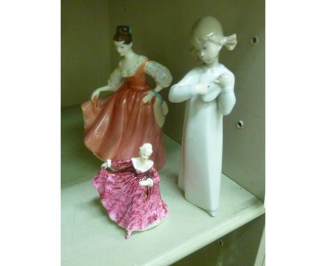 Ceramic figures, viz. 'Fairlady'  HN2835  8''h; 'Kirsty'  HN3213  3.5''h; and a Lladro porcelain model, a young girl in a nig