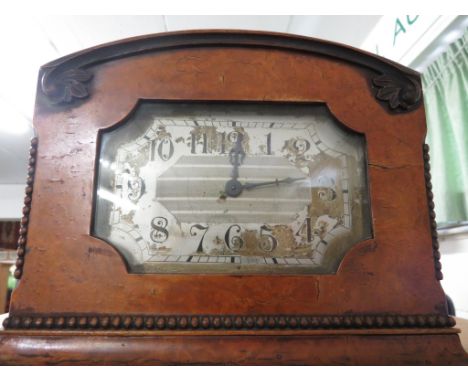 A WALNUT VENEER MANTEL CLOCK WITH SWISS MOVEMENT. (A/F)
