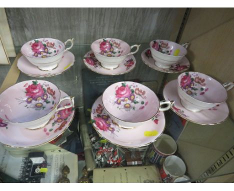 SET OF SIX PARAGON CHINA TEA CUPS AND SAUCERS IN A FLORAL PATTERN.