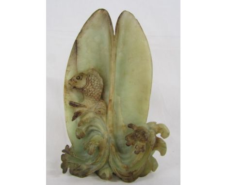 Carved fish resting in a shell possibly jade - approx. 23.5cm tall