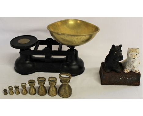 Cast iron balance weighing scales with 8 weights and a Buchanan's Black &amp; White Scotch Whisky cast iron advertising piece