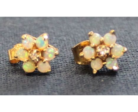 Pair of 14k gold &amp; opal flower stud earrings with central diamond chip, 1.6g