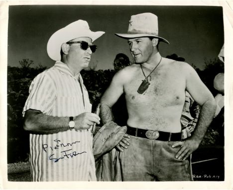 FULLER SAMUEL: (1912-1997) American film director. Vintage signed and inscribed 10 x 8 photograph of Fuller standing in a thr