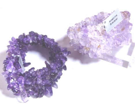 AMETHYST BRACELETS. Two boxed amethyst bracelets