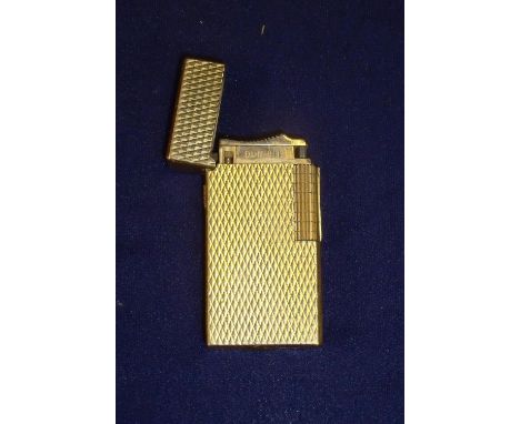Dunhill gold plated pocket lighter with engine turned diamond detail, the base stamped Dunhill London 