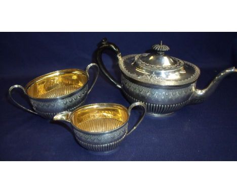 Sheffield 1898 silver hallmarked three piece tea service with engraved border detail and embossed ribbed detail to the base, 