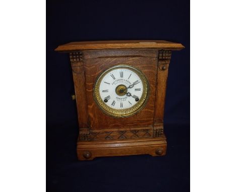 Oak cased Fattorini & Sons patent automatic alarm clock, Bradford Patent No 16226 (32cm high) 