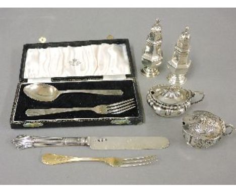 A pair of silver pepperettes, two silver mustard pots, a silver knife, silver gilt fork, and a christening fork and spoon by 