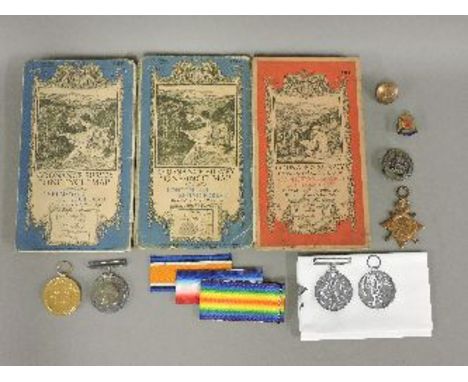 A WWI trio of medals, awarded to Private H A Maxwell, Wiltshire Regiment, two further badges and a button, and four ordnance 