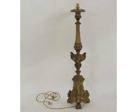 A Florentine style carved wooden table lamp, painted gold, 100cm high