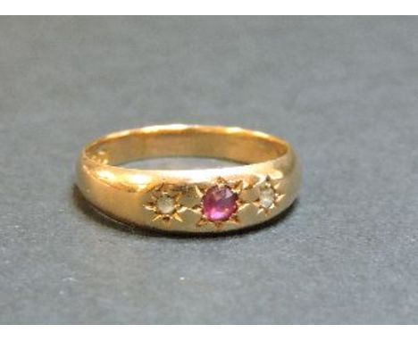 A 15ct gold ruby and diamond three stone star set gypsy ring