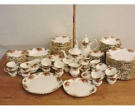 A Royal Albert Country Roses china dinner and tea service, comprising twenty-three dinner plates, thirty side plates, eight d