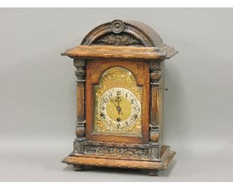 A late Victorian mahogany three train mantel clock