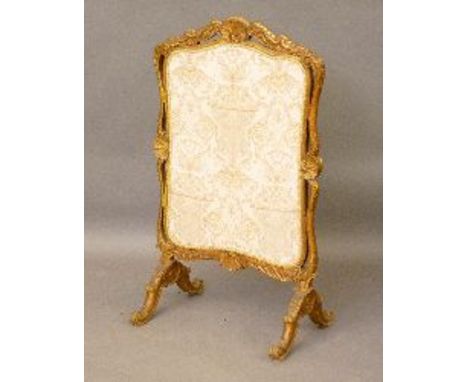 A Victorian carved giltwood fire screen, 109cm high