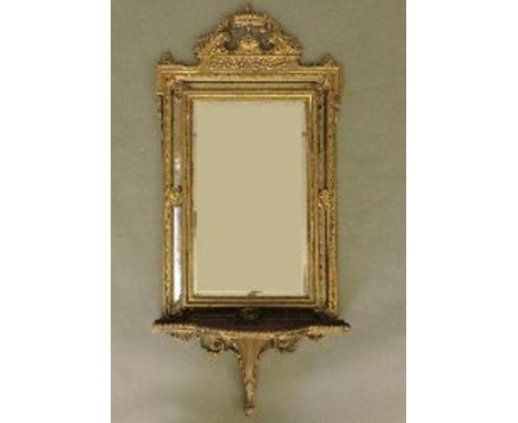 A Victorian gilt wall mirror, with shelf