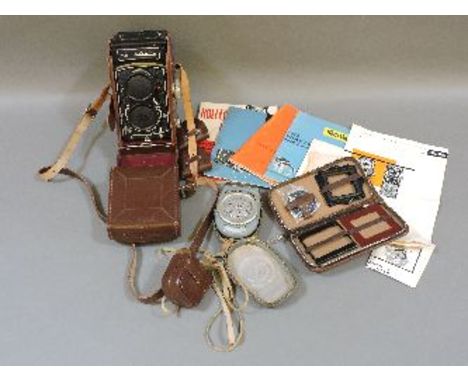 A Rolleicord TLR camera, with synchro-compur lens, leather case, and assorted accessories, including spare lenses