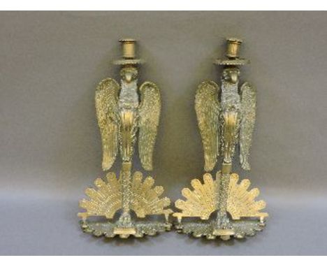 A pair of brass candlestick brackets